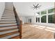 Bright living room with light wood floors, staircase and large windows at 863 N Bay Overlook, Villa Rica, GA 30180
