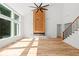 Spacious living room with fireplace, vaulted ceiling, staircase, and hardwood flooring at 863 N Bay Overlook, Villa Rica, GA 30180