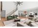 Open-concept living area with modern decor, adjacent to a bright, stylish kitchen at 863 N Bay Overlook, Villa Rica, GA 30180