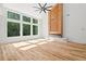Bright and airy living room featuring large windows, vaulted ceiling, and hardwood floors at 863 N Bay Overlook, Villa Rica, GA 30180