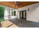 Covered outdoor patio featuring a ceiling fan and double doors to the interior at 863 N Bay Overlook, Villa Rica, GA 30180