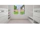 Spacious walk-in closet with built-in shelving and drawers; filled with natural light at 863 N Bay Overlook, Villa Rica, GA 30180