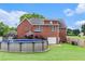 View of the backyard and above ground pool, featuring a brick home and green grass at 1112 Sutton Dr, Mcdonough, GA 30252