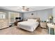 Relaxing bedroom with a neutral color scheme, ceiling fan, and ample natural light at 1112 Sutton Dr, Mcdonough, GA 30252