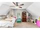 Cozy bedroom with carpet, a ceiling fan, and bright natural light, perfect for or guests at 1112 Sutton Dr, Mcdonough, GA 30252