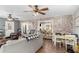 Inviting living room with a brick accent wall, and open layout at 1112 Sutton Dr, Mcdonough, GA 30252