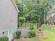 Backyard with a wrought iron fence, steps to the yard, and exterior door at 1245 Smokehouse Trl, Cumming, GA 30041