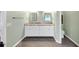 Bathroom featuring a double vanity with granite countertop and tile floors at 1245 Smokehouse Trl, Cumming, GA 30041