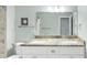 Bathroom features a large mirror, double sinks, light granite counters and tiled floors at 1245 Smokehouse Trl, Cumming, GA 30041