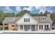 Beautiful clubhouse with stone accents, outdoor seating, and large windows overlooking the inviting community pool at 1245 Smokehouse Trl, Cumming, GA 30041