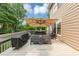Spacious deck with patio furniture and large shade umbrella at 1245 Smokehouse Trl, Cumming, GA 30041