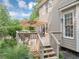 Home's wooden deck with shade umbrella and stairs at 1245 Smokehouse Trl, Cumming, GA 30041