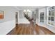 Dining area with bay window and decorative trim, showcases the hardwood floors and offers a view of the front entry at 1245 Smokehouse Trl, Cumming, GA 30041
