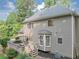Two-story home with a deck, bay window and greenery at 1245 Smokehouse Trl, Cumming, GA 30041