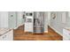 A kitchen featuring stainless steel appliances, granite countertops, and modern white cabinetry at 1245 Smokehouse Trl, Cumming, GA 30041