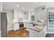 A kitchen featuring all white cabinets, wood flooring, stainless appliances and light countertops at 1245 Smokehouse Trl, Cumming, GA 30041