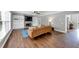 Bright living room with hardwood floors, stone fireplace, and built-in shelving, perfect for relaxing or entertaining at 1245 Smokehouse Trl, Cumming, GA 30041