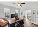 Bright office space with hardwood floors, white trim, and large windows offering natural light and neighborhood views at 1245 Smokehouse Trl, Cumming, GA 30041