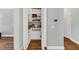 An open pantry with shelving and a lower drawer, with hardwood floors at 1245 Smokehouse Trl, Cumming, GA 30041