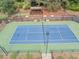 Aerial view of a tennis court with stadium seating and a gazebo; community park at 1245 Smokehouse Trl, Cumming, GA 30041