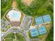 Aerial view featuring a sparkling pool, tennis courts, and lush greenery within the community at 2965 Westlington Cir, Cumming, GA 30040