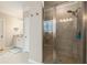 Bathroom showing the tile shower with glass doors and a granite vanity with a decorative window at 2965 Westlington Cir, Cumming, GA 30040