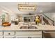 Open kitchen and living space featuring granite countertops, stainless appliances and lots of light at 2965 Westlington Cir, Cumming, GA 30040