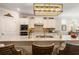 Kitchen island featuring a breakfast bar, granite countertops, and stainless steel appliances at 2965 Westlington Cir, Cumming, GA 30040