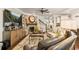 Inviting living room with a brick fireplace, ceiling fan, comfortable seating, and lots of natural light at 2965 Westlington Cir, Cumming, GA 30040