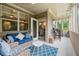 Cozy porch with comfortable seating, a ceiling fan, and a view into the dining area at 2965 Westlington Cir, Cumming, GA 30040