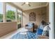 Relaxing screened porch featuring comfortable wicker furniture and a view to the backyard at 2965 Westlington Cir, Cumming, GA 30040