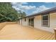 Large stained deck with railing provides an outdoor space for relaxing and entertaining at 3233 Glynn Mill Dr, Snellville, GA 30039