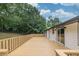 This wooden back deck overlooks the green lawn at 3233 Glynn Mill Dr, Snellville, GA 30039
