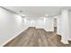 Large finished basement with modern lighting, new floors, and clean white walls at 3233 Glynn Mill Dr, Snellville, GA 30039