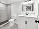 A bathroom with tiled shower, white vanity, framed mirror, and modern fixtures at 3233 Glynn Mill Dr, Snellville, GA 30039