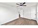 This bedroom has a sleek ceiling fan, laminate flooring and an open doorway at 3233 Glynn Mill Dr, Snellville, GA 30039