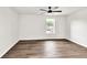 Bedroom with neutral walls and wood-look laminate floors, brightened by natural light at 3233 Glynn Mill Dr, Snellville, GA 30039