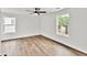 Bedroom with two windows offering natural light and hardwood floors at 3233 Glynn Mill Dr, Snellville, GA 30039