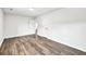 A spacious bedroom with wood-look floors features two white doors and white walls at 3233 Glynn Mill Dr, Snellville, GA 30039