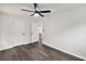 Bright bedroom featuring a ceiling fan, fresh paint, laminate flooring, and white doors at 3233 Glynn Mill Dr, Snellville, GA 30039