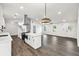 Bright open floor plan features white cabinets, marble countertop, and stainless steel appliances at 3233 Glynn Mill Dr, Snellville, GA 30039