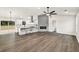 Open-concept living area with hardwood floors, modern fireplace, and abundant natural light at 3233 Glynn Mill Dr, Snellville, GA 30039