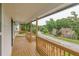 Spacious porch with wood railings and serene neighborhood views perfect for relaxation and enjoyment at 3233 Glynn Mill Dr, Snellville, GA 30039