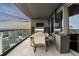 Relaxing balcony featuring a dining table, TV, fireplace and stunning city views at 3344 Peachtree Ne Rd # 3405, Atlanta, GA 30326