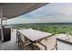 Open-air balcony with stunning city views and comfortable dining space at 3344 Peachtree Ne Rd # 3405, Atlanta, GA 30326