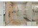 A luxury tiled shower with bench, rainfall head and multiple shower heads at 3344 Peachtree Ne Rd # 3405, Atlanta, GA 30326