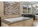 A luxurious bathroom features a soaking tub, vanity, and a mirror at 3344 Peachtree Ne Rd # 3405, Atlanta, GA 30326
