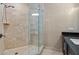 This bathroom features a vanity with dark cabinets and a glass shower at 3344 Peachtree Ne Rd # 3405, Atlanta, GA 30326