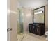 This bathroom features a vanity with dark cabinets and a glass shower at 3344 Peachtree Ne Rd # 3405, Atlanta, GA 30326