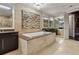 A luxurious bathroom features a soaking tub, vanity, and a mirror at 3344 Peachtree Ne Rd # 3405, Atlanta, GA 30326